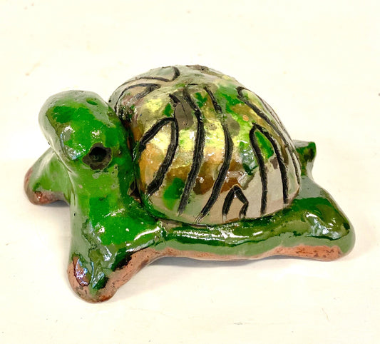 Boys, girls, men, and women of all ages talked about how cute they are. They got a kick out of and adored the turtles that were named after someone they knew". Tommie is 2" x 2" x 4" and weighs 5.8 ozs. Tommie has a glossy green and copper complexion. Tommie is ready to Go!!