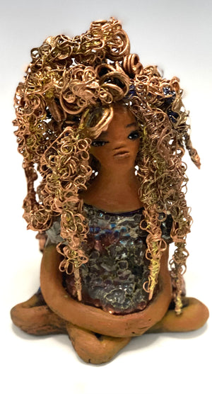Meet Tiana! Tiana stands 5" x 3.5" x 3.5" and weighs 10 ozs. She has a lovely honey brown complexion. Tiana's dress is  metallic copper. She has her long loving arms resting at her side. " I am really pleased  with Tiana's blue beaded necklace and her new wire hair Find a place in your space for Tiana!