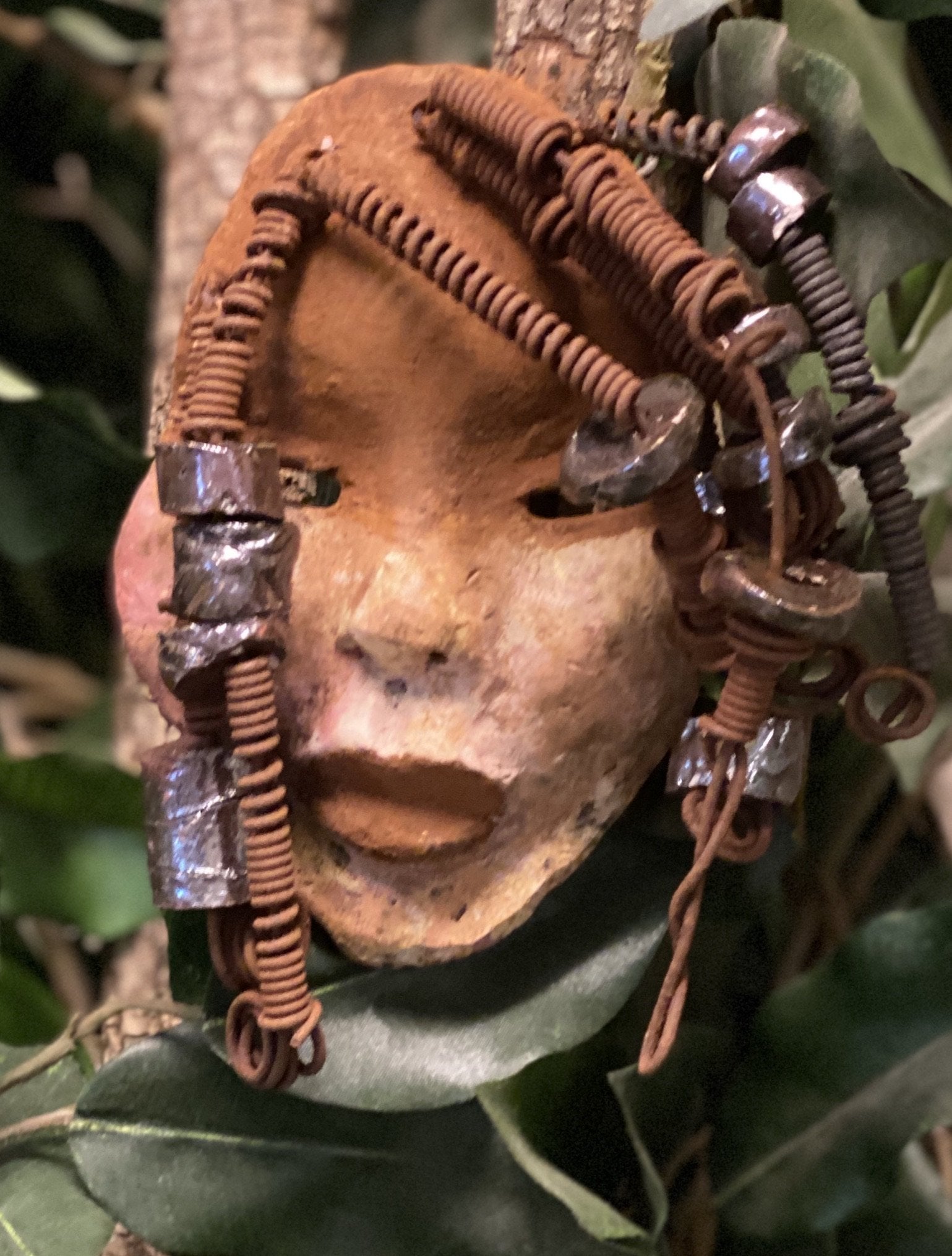 Macey  has a complexion of light and dark honey. She is 5" x 7" and weighs 1.1 lbs. Macey has over 20 handmade raku fired beads. She has over 15 feet of coiled 16 gauge wire hair.
