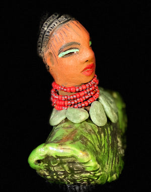 Meet Chanellie!  Can you sing? I can imagine being next to Chanellie you better know how! Chanellie stands 8" x 9" x 4 and weighs 2.11 lbs. Chanellie has a nice honey brown complexion and wears glasses. She has over 8 feet of 16 gauge wire hair. Chanellie wears a textured white crackle robe. She is angelic! Chanellie will make a great gift or starter piece from the Herdew Collection! Check out our Shipping and Return policy.