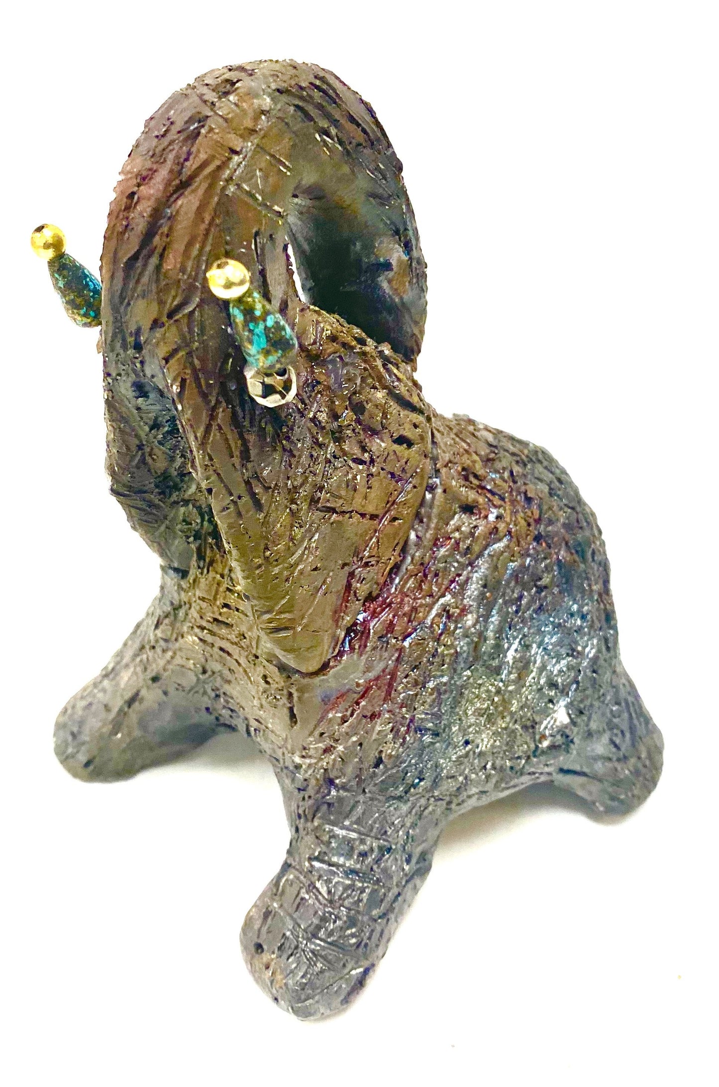 Have you HERD!!!!!!     Elephants are one of my favorite animals to create. They are so majestic"  Just one of these lovely Raku Fired Elephant will make an excellent gift for your  BFF,  or just for you .    This raku fired baby elephant sits 5.5" x 4" x 4" and weighs 10 ounces. She has beaded tusks and a textured copper body.  This little baby is Nice!