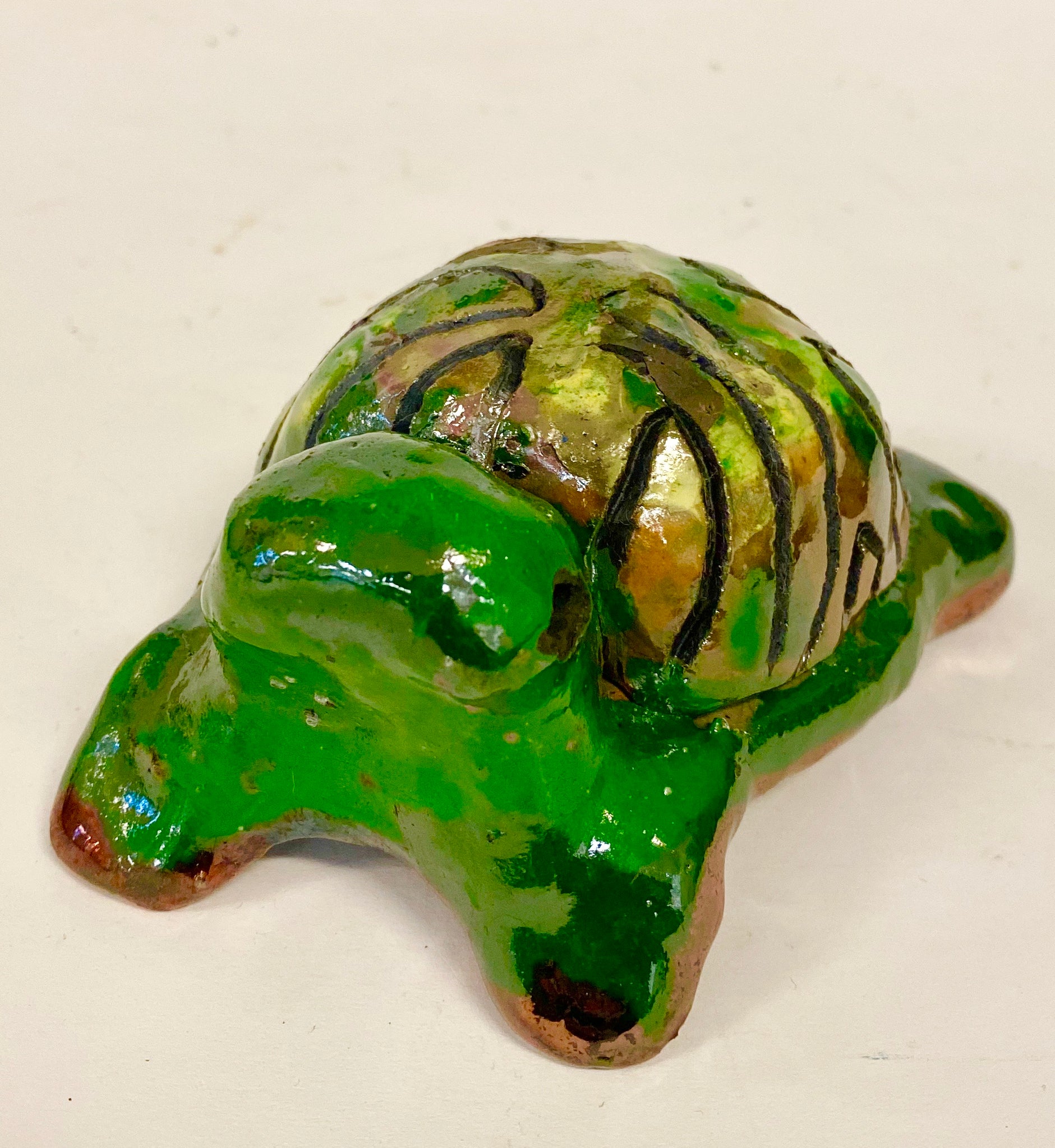 Boys, girls, men, and women of all ages talked about how cute they are. They got a kick out of and adored the turtles that were named after someone they knew". Tommie is 2" x 2" x 4" and weighs 5.8 ozs. Tommie has a glossy green and copper complexion. Tommie is ready to Go!!