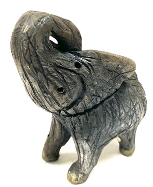 Have you HERD!!!!!!     Elephants are one of my favorite animals to create. They are so majestic"  Just one of these lovely Raku Fired Elephant will make an excellent gift for your  BFF,  or just for you .    This baby raku fired elephant stands 4" x 3" x 4.5" and weighs 10 ounces. She tusk less with a textured charcoal  body. Nice!