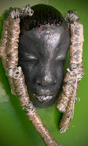Meet Abbas! I started making art soon after seeing authentic African artwork at the Smithsonian Museum of African Art. I was in total awe.  Abbas was inspired by my visit there.   Abbas  4" x 7" and weighs 8.6 ozs. Abbas's face is a lovely smoky black. She has nine textured beads that are off white dread locks.