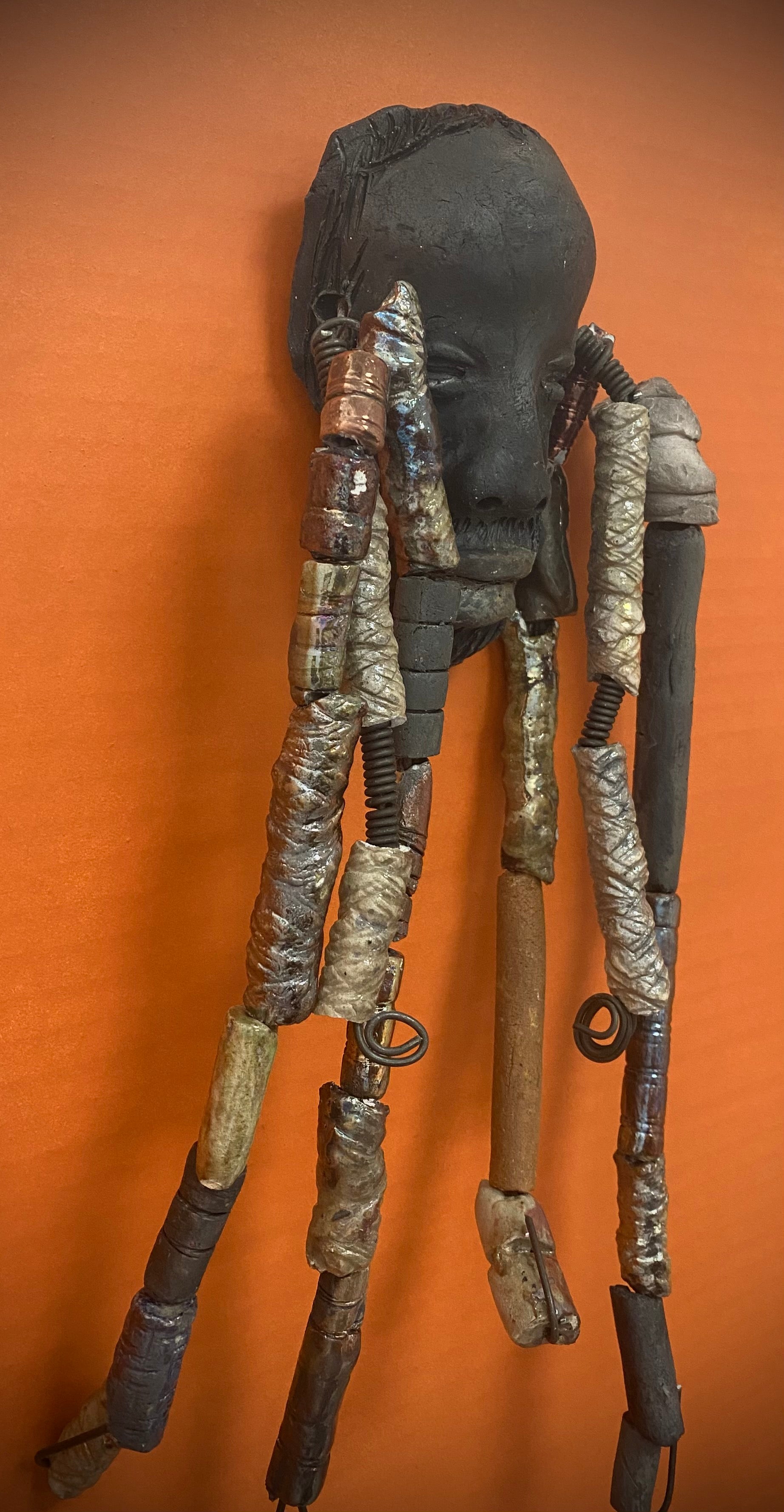 Meet Cain! You Like Wise men; You gotta Love Cain! I started making art soon after seeing authentic African artwork at the Smithsonian Museum of African Art. I was in total awe. Cole was inspired by my visit there.   Cain is a wise and distinguished  bearded gentleman who has a smoky dark complexion. He is approximately 5" x 11" and weighs 13 ozs. Cain has an aged hairstyle of more than 20 handmade textured clay dreadlocks along with twist of coiled 16 gauge wire.