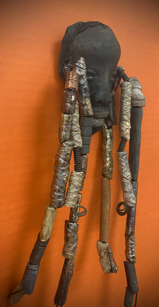 Meet Cain! You Like Wise men; You gotta Love Cain! I started making art soon after seeing authentic African artwork at the Smithsonian Museum of African Art. I was in total awe. Cole was inspired by my visit there.   Cain is a wise and distinguished  bearded gentleman who has a smoky dark complexion. He is approximately 5" x 11" and weighs 13 ozs. Cain has an aged hairstyle of more than 20 handmade textured clay dreadlocks along with twist of coiled 16 gauge wire.