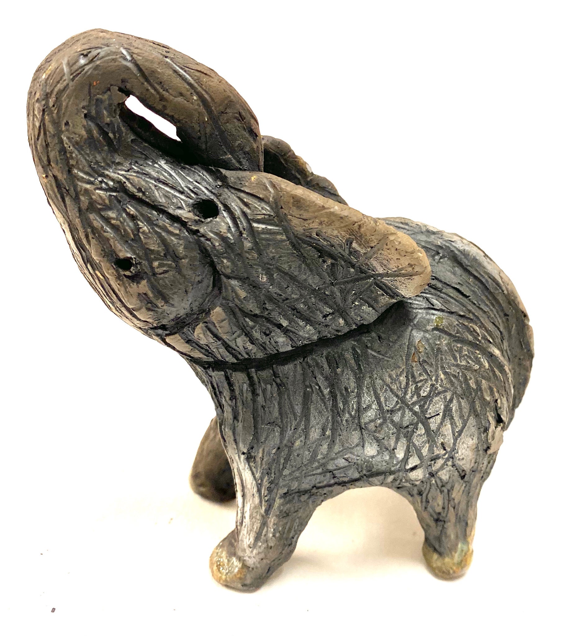Have you HERD!!!!!!     Elephants are one of my favorite animals to create. They are so majestic"  Just one of these lovely Raku Fired Elephant will make an excellent gift for your  BFF,  or just for you .    This baby raku fired elephant stands 4" x 3" x 4.5" and weighs 10 ounces. She tusk less with a textured charcoal  body. Nice!