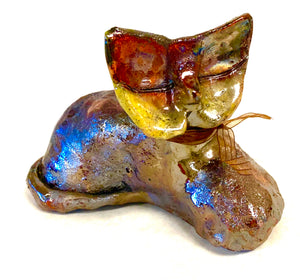 Rachel lays 5" x 4" x 7" and weighs 1.2 lbs. She has an off white and Colorful metallic body. Rachel will sit anywhere without getting into trouble! This Little Kitty could be an excellent gift.