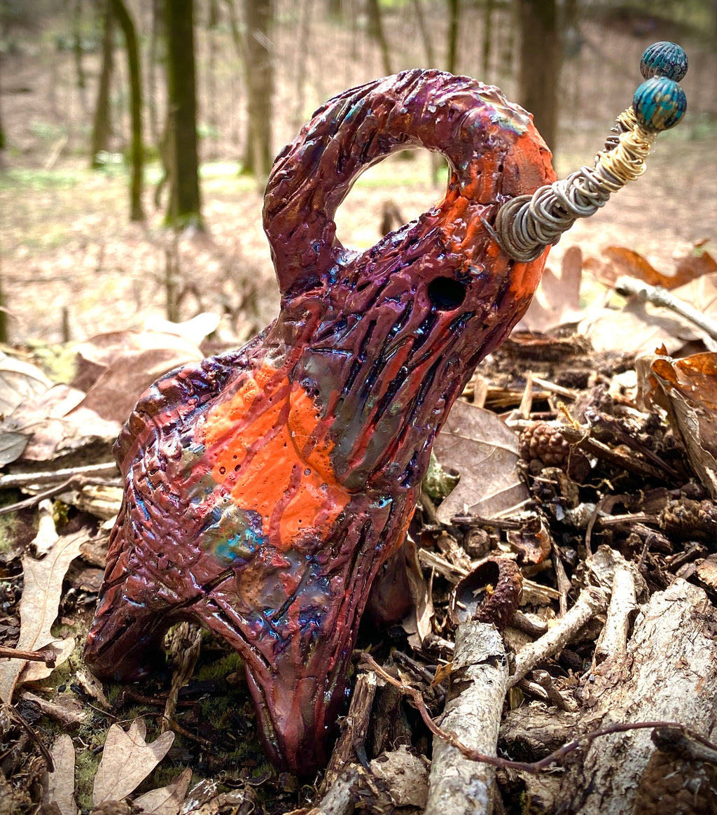 Have you HERD!!!!!!  Just one of these lovely Raku Fired Elephant will make an excellent gift for your  friend, sorority or for your home’ special place centerpiece.   8.5" x 3" x 5" 15 ozs Beautiful two tone copper and orange rust raku elephant. Beaded tribal tusk. For decorative purposely only