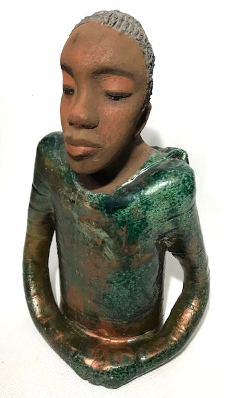      Ivani s the third young man to be introduced in this collection.     Ivan stands 17" x 9" x 10" and weighs 8.12 lbs.     Ivan has an awesome honey brown complexion.     He wears copper green hoodie     Ivan's  hair is made of  clay, black grey, and wavy.  Give Ivan a special place in your home. Free Shipping!