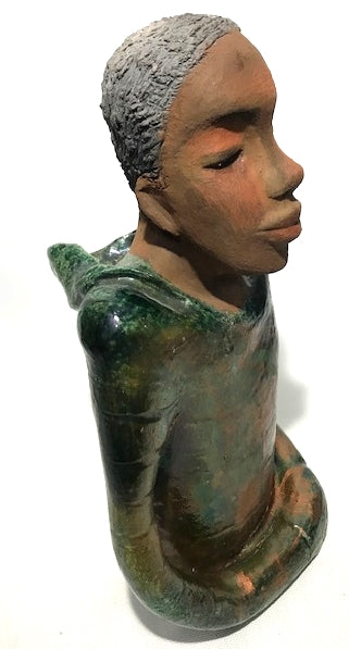      Ivani s the third young man to be introduced in this collection.     Ivan stands 17" x 9" x 10" and weighs 8.12 lbs.     Ivan has an awesome honey brown complexion.     He wears copper green hoodie     Ivan's  hair is made of  clay, black grey, and wavy.  Give Ivan a special place in your home. Free Shipping!