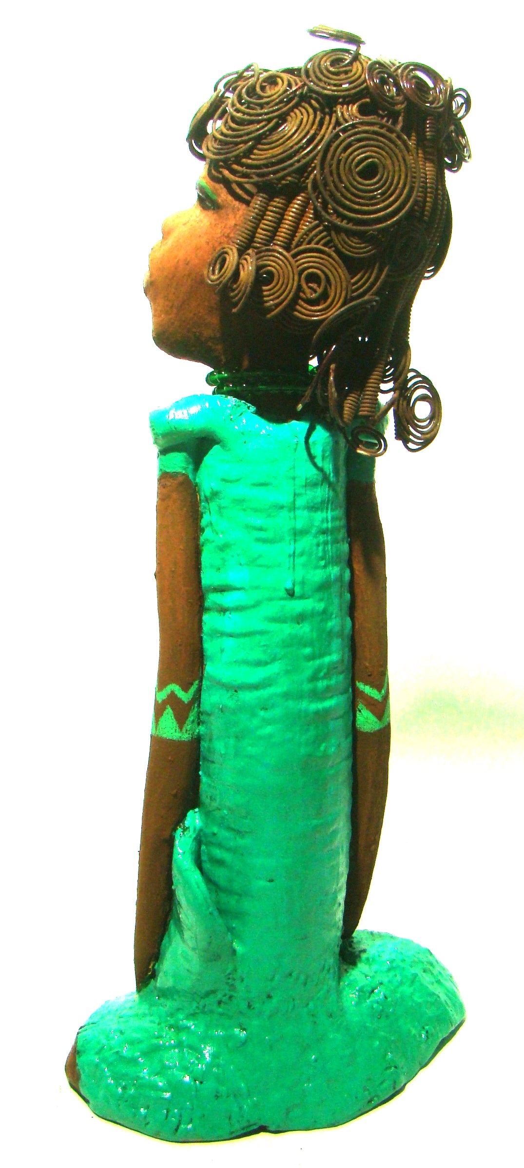      Melissa stands 18" x 9" x  5" and weighs 6.6 lbs.     She has over 30 feet of wire curls, twist, and coiled hair.     Melissa has a lovely honey brown complexion.     She has a aqua blue green dress with matching open purse.     Melissa is a tall statuesque goddess that awaits a new home.     Free Shipping!