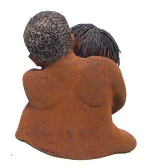  Loving You stands ﻿9" x 9" x 5" and weighs 5.02 lbs. He has a honey brown complexion, she is high beige brown. She has vertical yellow brown on her dress. His arms are totally wrapped around her.